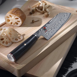 Miyabi Kaizen II 6.5-inch Bunka kitchen knife with sharp blade and traditional Japanese design, ideal for precise slicing.