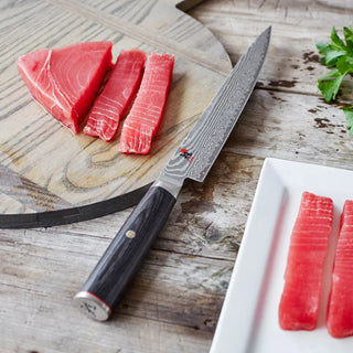 Miyabi Kaizen II 9.5-inch slicing knife with a sharp blade and ergonomic handle, designed for precise kitchen slicing tasks.