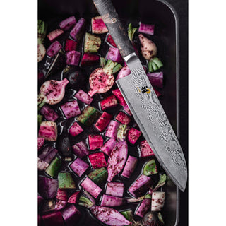 Miyabi Black 5000 8-inch chef knife with sharp stainless steel blade and ergonomic black handle, ideal for precise kitchen prep.