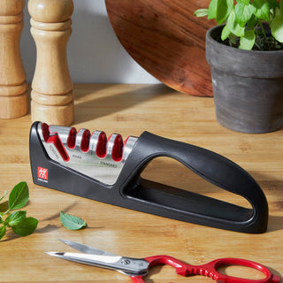 Zwilling 4-stage sharpening tool with shear sharpener for precise knife and scissors sharpening, compact and easy to use.