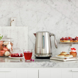 Breville Smart Luxe 1506 kettle in stainless steel with digital controls and sleek modern design.