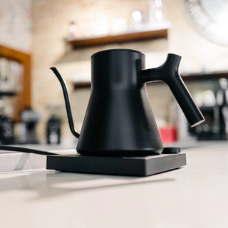 Fellow Stagg EKG Pro electric kettle in matte black, showcasing a sleek design with a modern spout and digital temperature control.