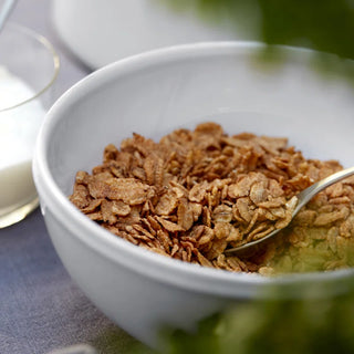 White Friso cereal bowl from Costa Nova's 2201 dinnerware collection, showcasing a smooth, rounded ceramic design.
