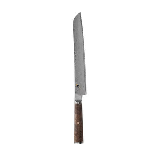 Miyabi Black 5000 9.5-inch bread knife with a sharp stainless steel blade and ergonomic handle for precise slicing.