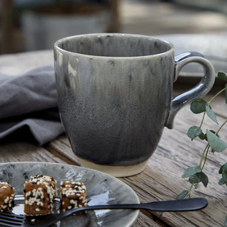 Madeira handmade stoneware coffee mug in grey, from Costa Nova's 2201 dinnerware collection, showcasing a sleek, modern design.