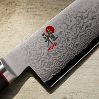 Miyabi Kaizen 5-inch prep knife with a sleek stainless steel blade and ergonomic handle, ideal for precise kitchen prep tasks.