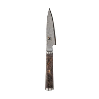 Miyabi Black 5000 3.5-inch paring knife with black handle and sharp stainless steel blade for precise kitchen prep.