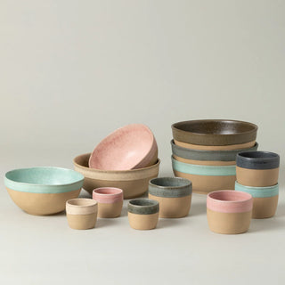 Costa Nova Poke Bowl Arenito dinnerware in champagne yellow with a smooth, rounded ceramic design, perfect for serving meals.