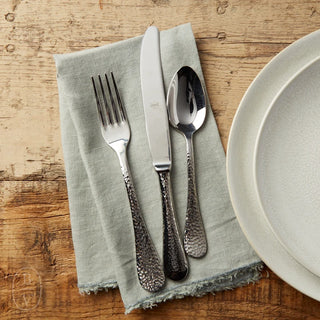 Mepra SPA Epoque Flatware Set of 5, 2202 FLATWARE, featuring sleek stainless steel utensils arranged on a wooden surface.