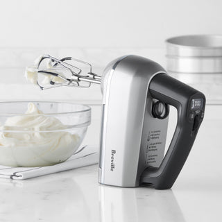 Breville Handy Mix Scraper™ in use, showing its ergonomic design and mixing capabilities with a blender or mixer.